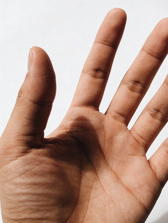 Human hand on a white background, close-up, selective focusの写真素材
