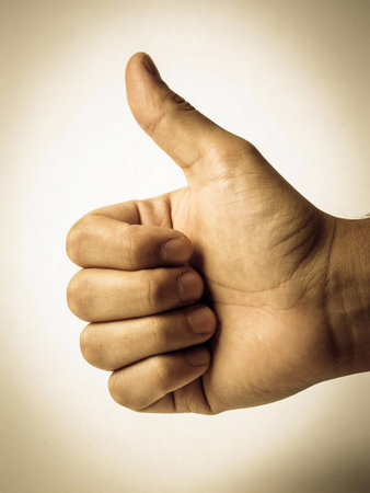 thumbs up on a white background with filter effect retro vintage style
