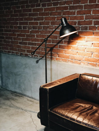 Lamp and sofa in vintage room - Vintage filter processing style picturesの写真素材