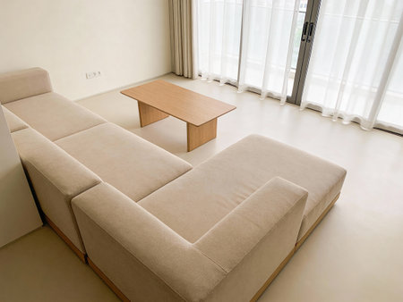 Interior of a modern living room, sofa and wooden coffee table