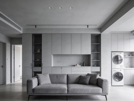Interior of modern kitchen with gray walls, concrete floor, grey sofa and white cupboards. 3d...