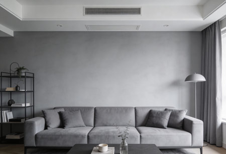 Interior of modern living room with grey sofa, coffee table and bookshelfの写真素材