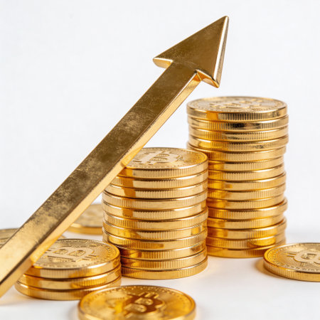 golden coins and arrow up on white background, business growth conceptの写真素材