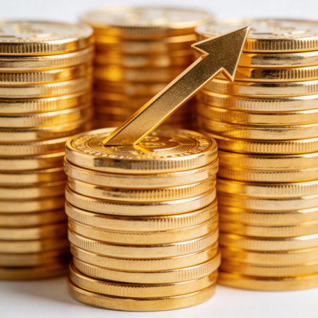 Stacks of gold coins with up arrow. Financial success concept.の写真素材