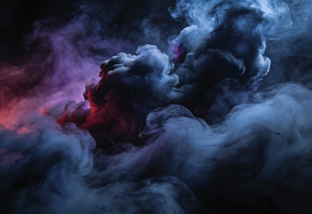 Cloud of blue, pink and purple smoke on a black isolated background.の写真素材
