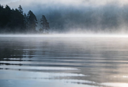 Foggy morning on the lake in the mountains, Finland.