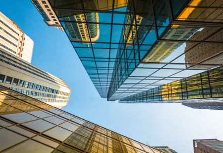 Low angle view of modern skyscrapers in hongkongの写真素材
