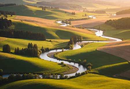 Beautiful landscape with a river in the middle of the field.の写真素材