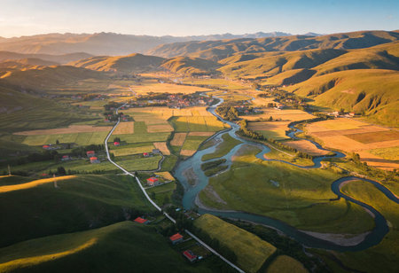 Aerial view of a small village in the mountains at sunset.の写真素材