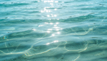 Sea water background with sunbeams. Sea water background. Water texture.の写真素材