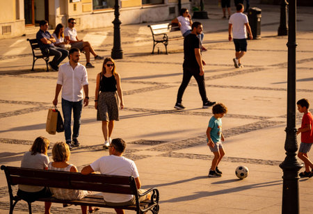 View of unknowns people walking in the streets of Seville, an emblematic city and the capital of the...