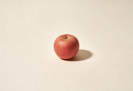 Red apple on a white background, shallow depth of field, selective focus