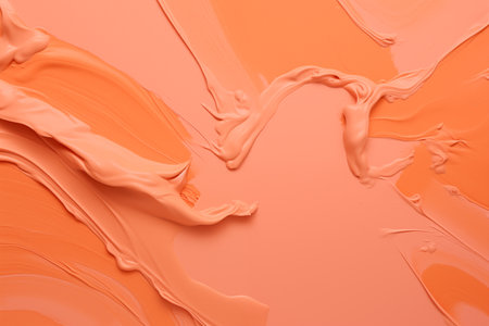 Abstract background with smooth wavy lines in peach fuzz colors. Cosmetic cream smudge texture as background, closeup.の素材