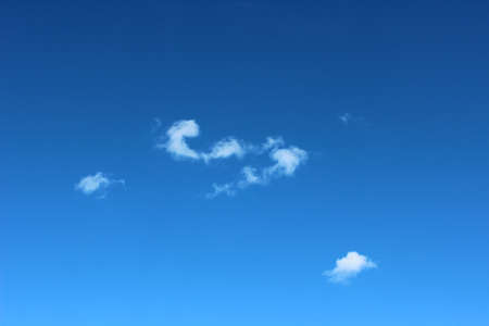 White clouds with blue sky background, blank on blue sky for sample text 