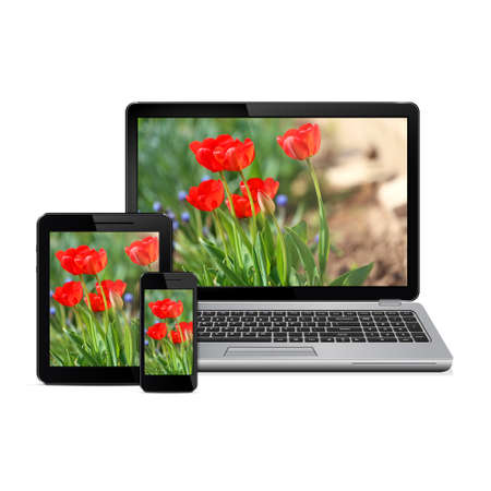 Laptop tablet computer and smartphone with flowers on screen