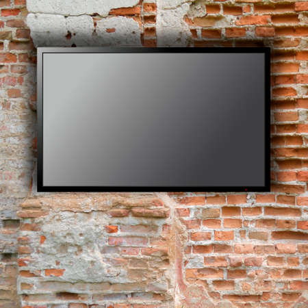 Blank tv on the brick wall with copy spaceの写真素材