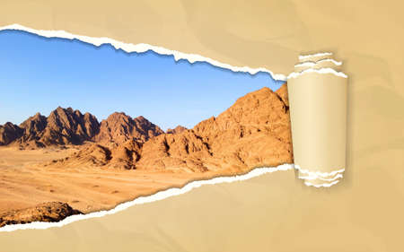 Torn paper with mountain landscape in opening background