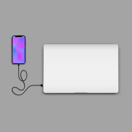 Phone connected to closed laptopのイラスト素材