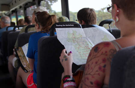 Gettysburg, PA USA. Jul 2015. Passengers reading tour guides and maps on board a tour bus at the Gettysburg National Military Park.のeditorial素材