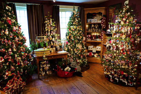Wilton, CT USA. Nov 2018. Some of the adorable Christmas themed trees at the small but cozy The Historical Christmas Barn.のeditorial素材