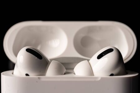 Kuala Lumpur, Malaysia - December 2019. Apple Airpods Pro isolated against black. The new airpods pro features active noise cancelling and  customizable fitのeditorial素材