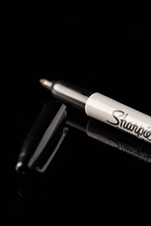Kuala Lumpur, Malaysia - December 2019. âSHARPIEâ permanent marker pen isolated against blackのeditorial素材
