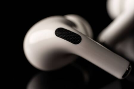 Kuala Lumpur, Malaysia - December 2019. Apple Airpods Pro isolated against black. The new airpods pro features active noise cancelling and  customizable fitのeditorial素材