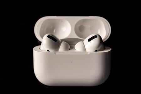 Kuala Lumpur, Malaysia - December 2019. Apple Airpods Pro isolated against black. The new airpods pro features active noise cancelling and  customizable fitのeditorial素材
