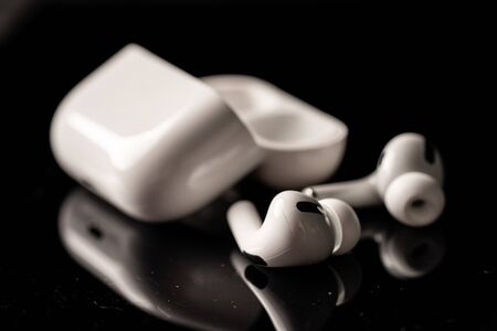 Kuala Lumpur, Malaysia - December 2019. Apple Airpods Pro isolated against black. The new airpods pro features active noise cancelling and  customizable fitのeditorial素材