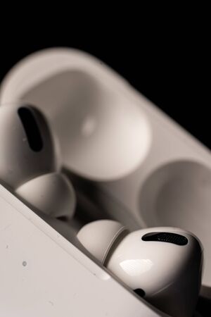 Kuala Lumpur, Malaysia - December 2019. Apple Airpods Pro isolated against black. The new airpods pro features active noise cancelling and  customizable fitのeditorial素材