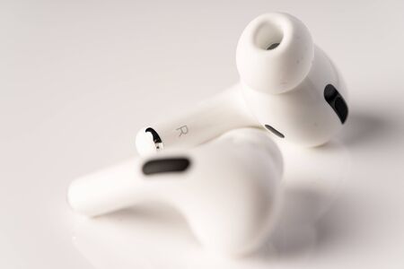 Kuala Lumpur, Malaysia - December 2019. Apple Airpods Pro isolated against black. The new airpods pro features active noise cancelling and  customizable fitのeditorial素材