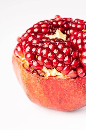 Fresh pomegranate isolated on whiteの写真素材
