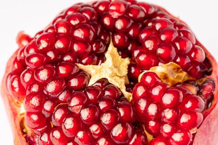 Fresh pomegranate isolated on whiteの写真素材
