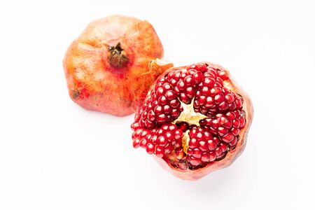 Fresh pomegranate isolated on whiteの写真素材