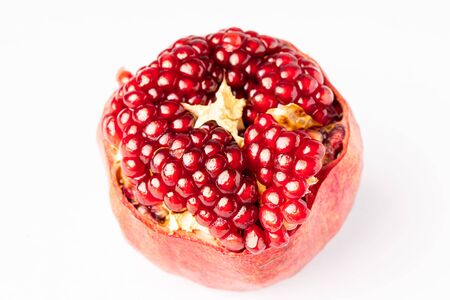 Fresh pomegranate isolated on whiteの写真素材
