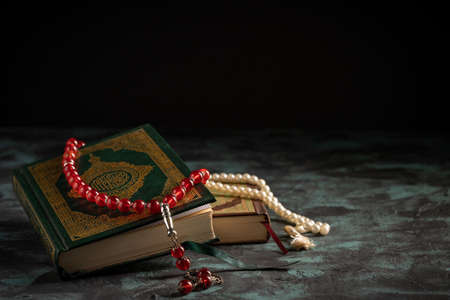 Islamic concept for eid and ramadan: The holy qoran with tasbih (rosary beads)の写真素材