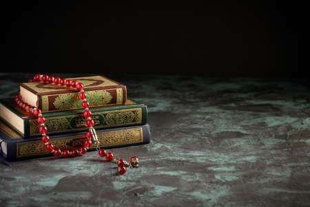 Islamic concept for eid and ramadan: The holy qoran with tasbih (rosary beads)の写真素材