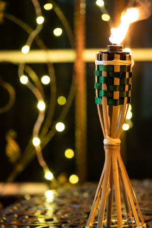 Bamboo oil lamp or pelita for eid or hari raya decoration with copy space for textの写真素材