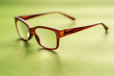 Spectacle or eye glass isolated against greenの写真素材