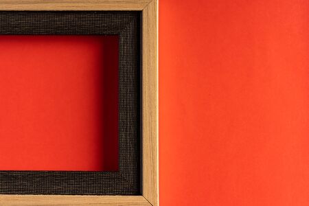 Empty photo frame against red background with copy space for textの写真素材