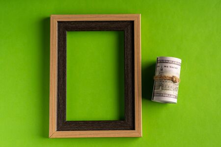 US Dollar bills against green background