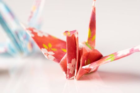Japanese crane origami isolated against white backgroundの写真素材