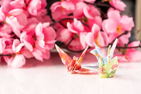 Japanese crane origami isolated against white backgroundの写真素材