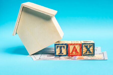 TAX wordings on woodens blocks with US Dollar billsの写真素材