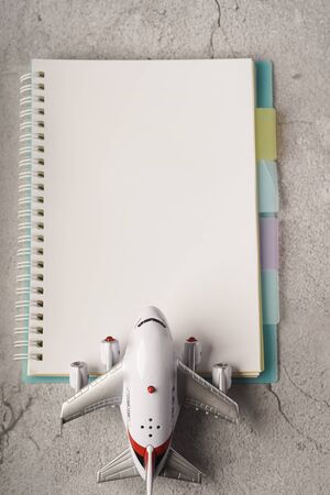 Blank notebook on white table with copy space for textの写真素材