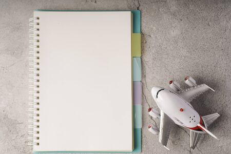 Blank notebook on white table with copy space for textの写真素材