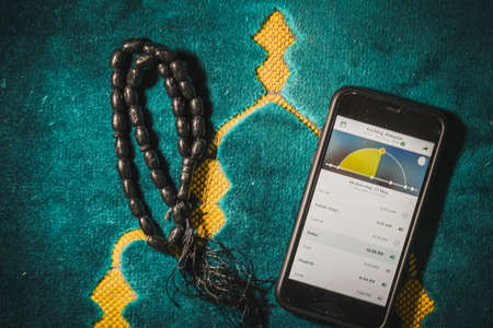 Digital Quran or Quran apps is used for muslim to read the text of Quran on an electronic device. Islamic flatlay conceptのeditorial素材