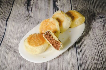 Bakpia Pathok are small, round-shaped Chinese-influenced Indonesian sweet rolls (bakpia), usually stuffed with mung beans, but have recently come in other fillings as wellの写真素材