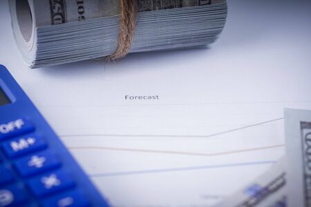 Business and Finance concept: flat lay composition of a work desk with papers, pen and calculatorsの写真素材