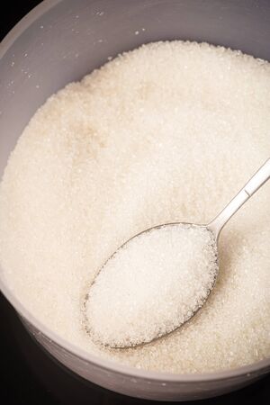 Diabetes Concept: Diabetes wordings on top of sugar heaps. November is World Diabetes Monthの写真素材